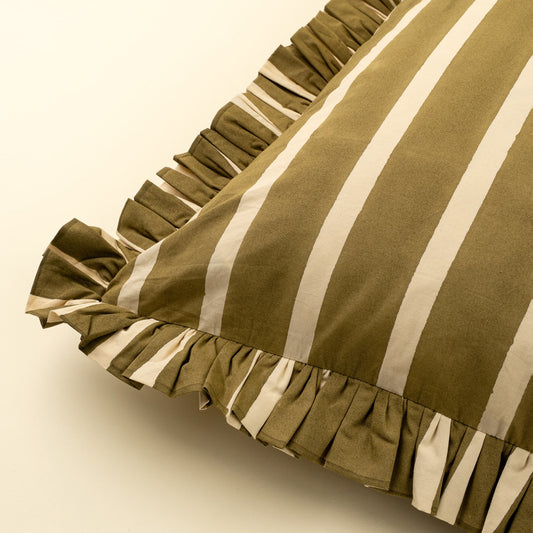 A close-up of a striped pillowcase with a ruffled edge, featuring vertical stripes in olive green and cream on a light beige background.