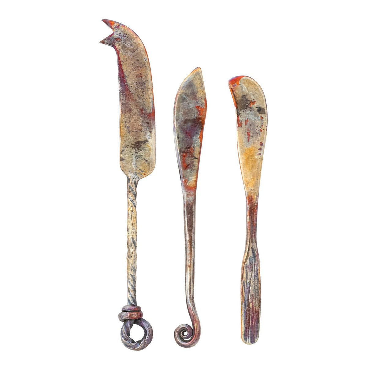 Three copper cheese knives on a white background.