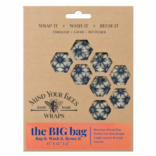 Blue starburst pattern beeswax bread bag in kraft card packaging on seamless background.