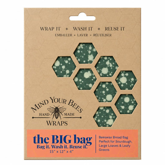 Dark green splatter pattern beeswax bread bag in kraft card packaging on seamless background.