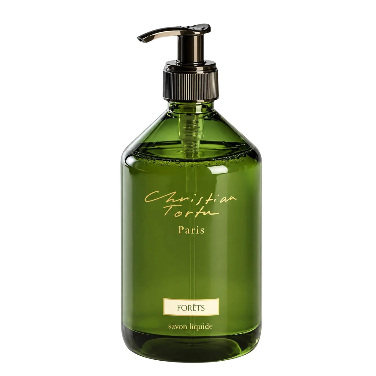 Christian Tortu's Forêts green glass liquid soap dispenser with a black pump and gold lettering, on a white background.