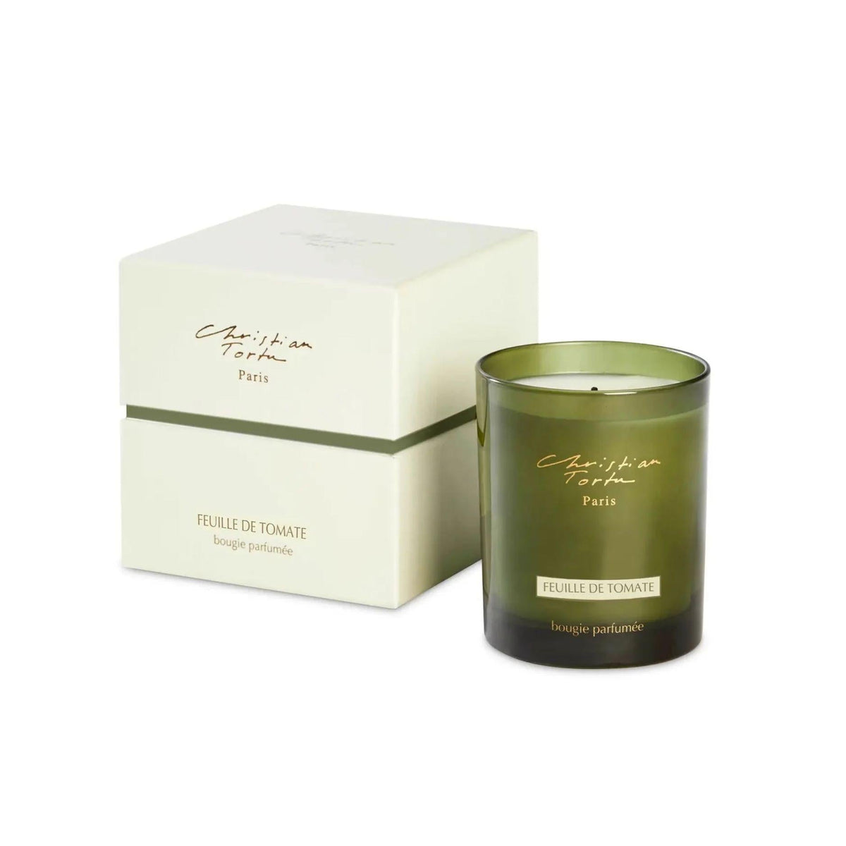 Christian Tortu's Feuille de Tomate green glass scented candle with box, on a white background.