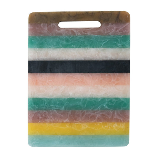 Colourful striped cutting board with a handle on a white background.