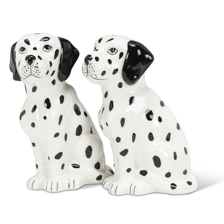 A pair of ceramic Dalmatian salt and pepper shakers sitting side-by-side on a white background.