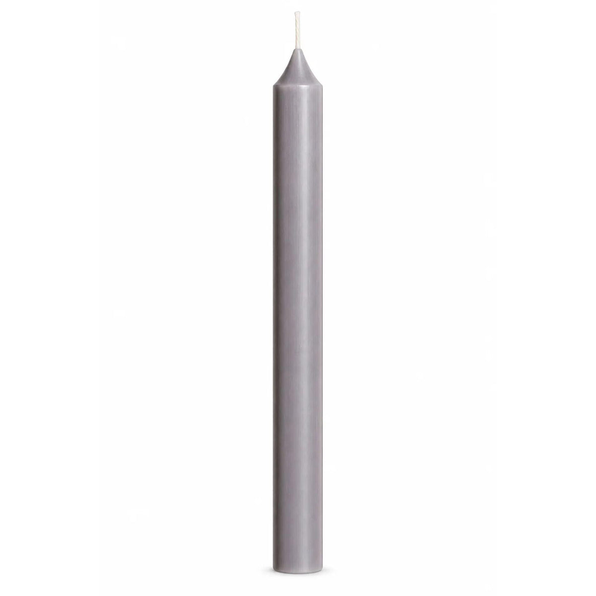 A single tall, slender pale cool grey taper candle with a white wick, centered against a solid white background.