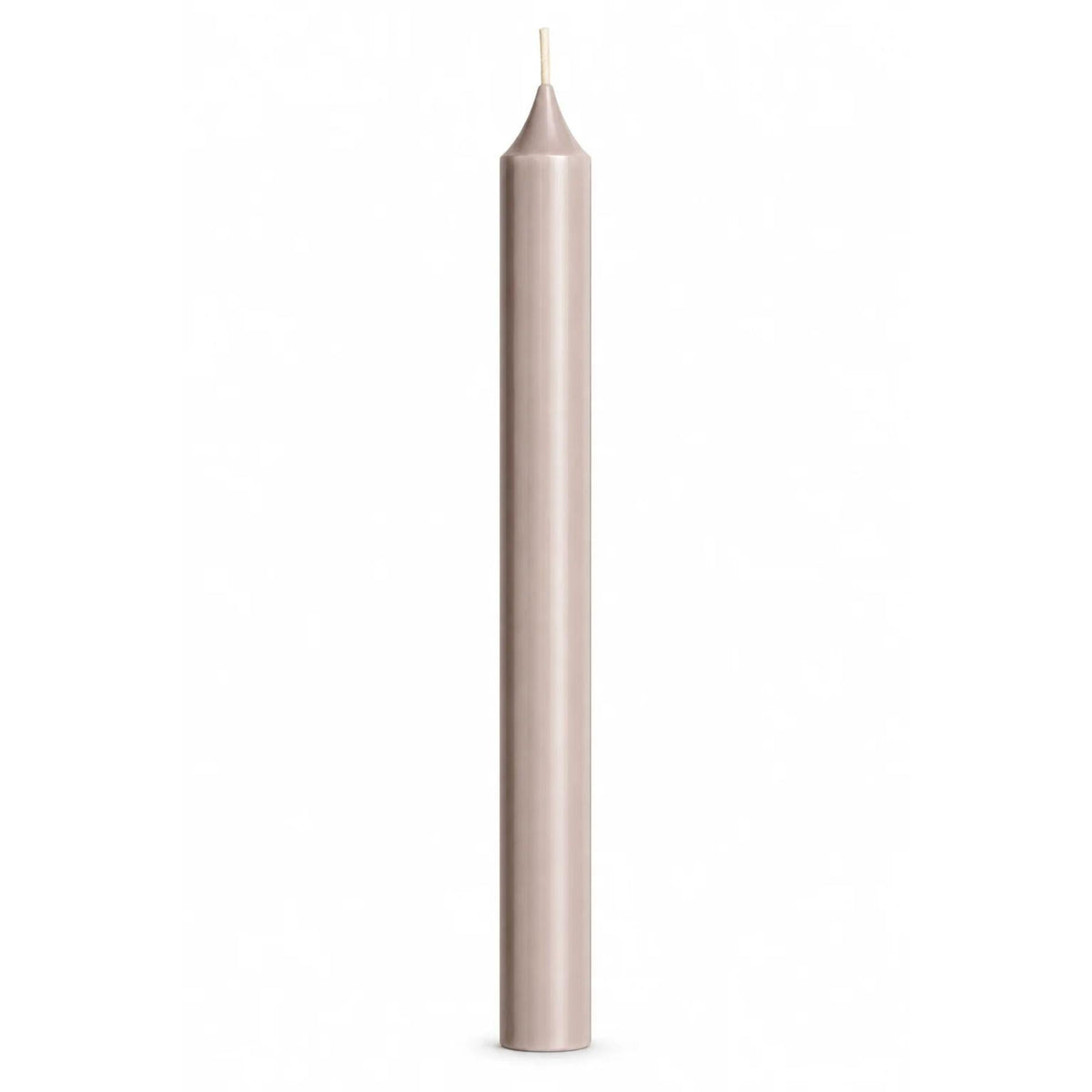 A single tall, slender pale warm grey taper candle with a white wick, centered against a solid white background.