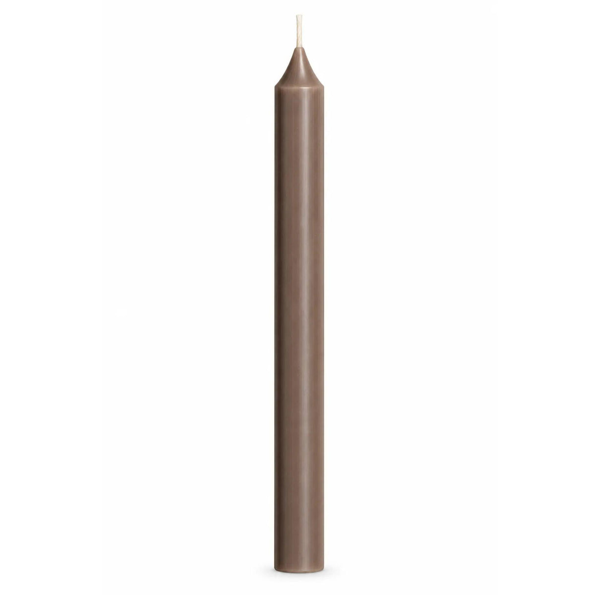 A single tall, slender beige-brown taper candle with a white wick, centered against a solid white background.