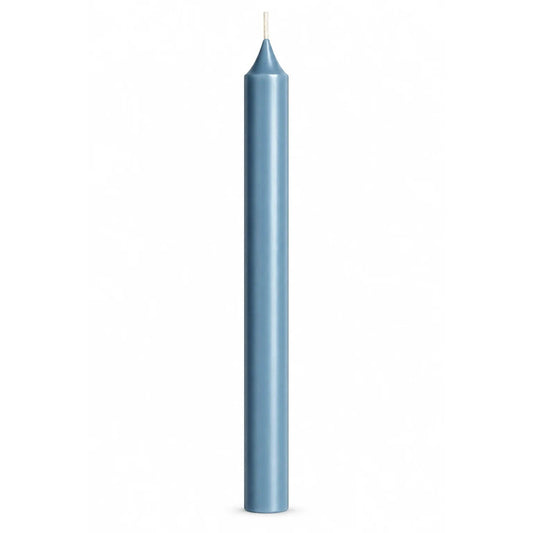 A single tall, slender blue-grey taper candle with a white wick, centered against a solid white background.