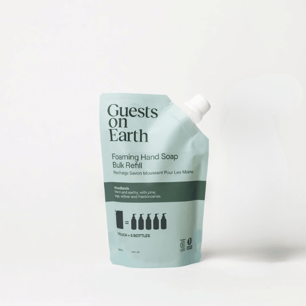 Guests on Earth Foaming Hand Soap Bulk Refill pouch in a pale mint green color with black text and a white spout cap, photographed on a clean white background.