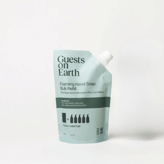 Guests on Earth Foaming Hand Soap Bulk Refill pouch in a pale mint green color with black text and a white spout cap, photographed on a clean white background.