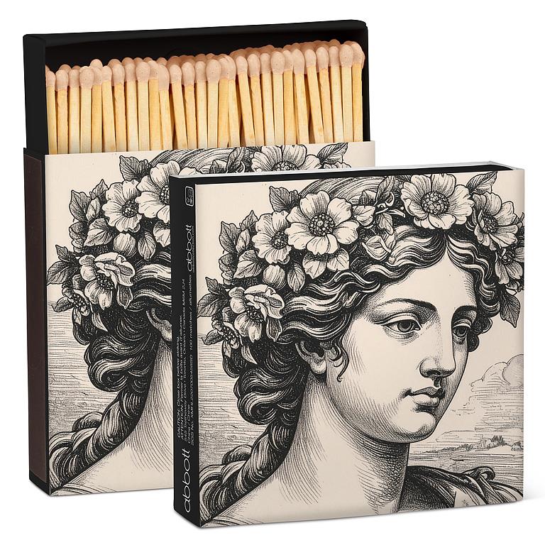 Matches with decorative box featuring a classical design of a woman's head with flowers.