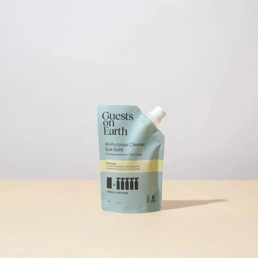 All-purpose cleaner refill pouch with 'Guests on Earth' branding on a light gray background.