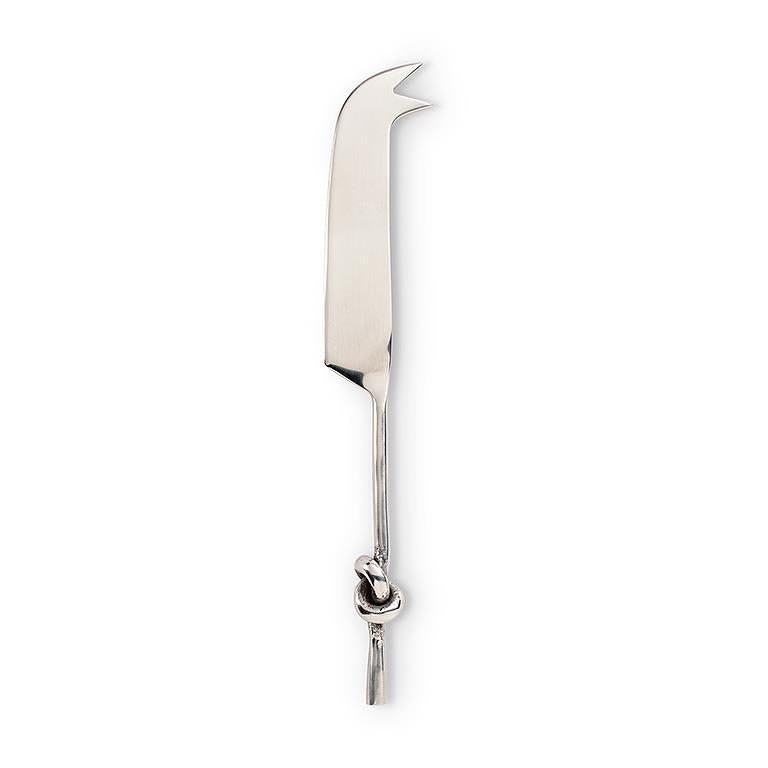 A polished chrome cheese knife with a decorative knot detail on the handle, shown vertically against a plain white background.