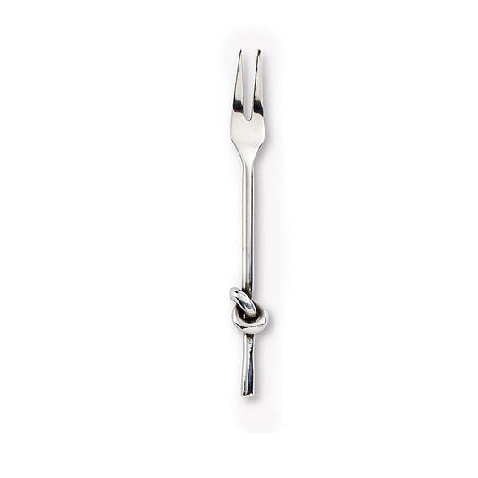 Chrome cocktail fork with knot detail on the handle, set on white background.