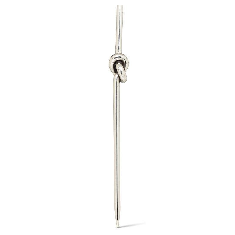 Chrome knot cocktail picks on a white background.