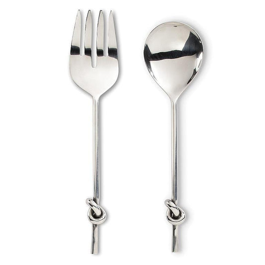 Chrome salad servers with knotted detail on handles, on a white background.