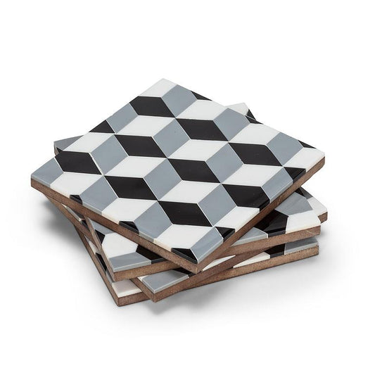 Four square coasters stacked at an angle, featuring a 3D optical illusion geometric pattern in black, white, and gray, with a natural wood edge visible on the side.