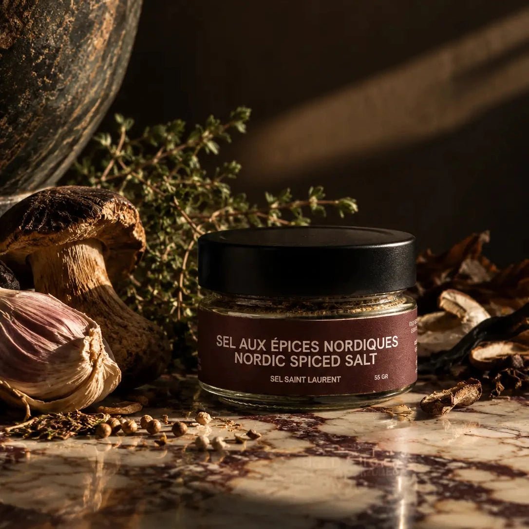 Nordic Spice Sea Salt from Salt Saint Laurent in Quebec, on dark background and marble countertop.