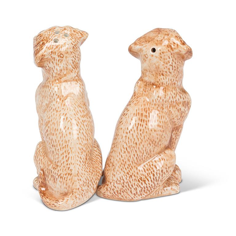 A pair of ceramic dog salt and pepper shakers, shown from the back on a white background.