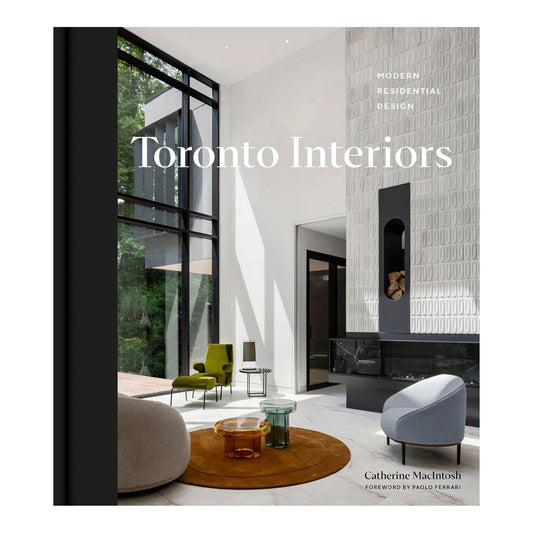 Book cover for 'Toronto Interiors: Modern Residential Design' by Catherine MacIntosh, featuring a photograph of a modern interior with large windows, a textured white wall, and contemporary furniture.