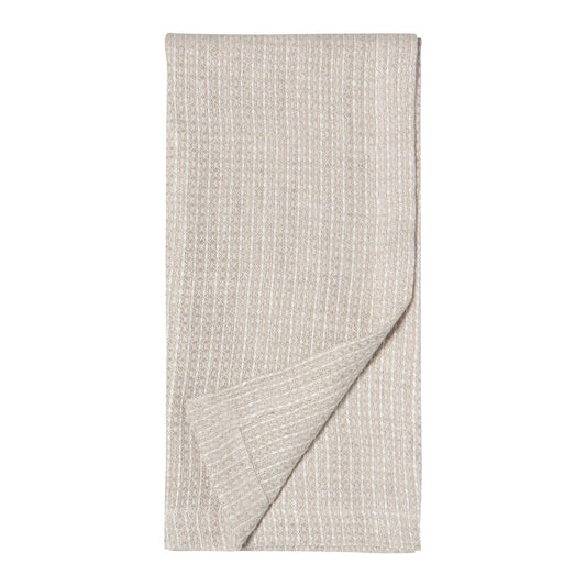 A folded beige textured sauna hand towel with a woven waffle pattern, shown on a solid white background.
